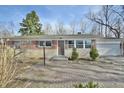 Brick ranch home with attached garage and paver driveway at 4575 Ayrshire St, Indianapolis, IN 46228