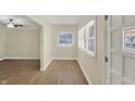 Inviting view of the entryway featuring hardwood floors, and abundant natural light from the windows at 4632 Normal Ave, Indianapolis, IN 46226