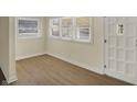 Bright entryway featuring wood-look flooring, neutral paint, and a multi-light white front door at 4632 Normal Ave, Indianapolis, IN 46226