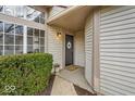 Welcoming front entrance with decorative wreath, well-maintained landscaping and cozy front porch at 6412 Bay Vista Ct, Indianapolis, IN 46250