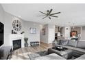 Spacious living room with a fireplace, large sectional sofa, and a flat-screen TV at 6559 Seabiscuit Rd, Whitestown, IN 46075