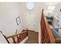 Bright entryway with staircase, wood railing, and octagonal window at 7564 Farm View E Cir, Indianapolis, IN 46256
