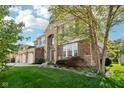 Charming two-story home featuring well-maintained landscaping, mature trees, and stone accents at 18725 Wychwood Pl, Noblesville, IN 46062