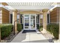 Condo building entrance with a pergola and columns at 420 W Jackson St # 42, Cicero, IN 46034