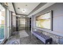 Modern condo lobby with elevator and seating area at 420 W Jackson St # 42, Cicero, IN 46034