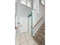 Bright entryway featuring tile flooring, a staircase, and a view to the upstairs at 493 Clearwater Blvd, Whiteland, IN 46184