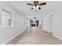 Bright living room with light wood floors and an open layout leading to the kitchen at 55 E Regent St, Indianapolis, IN 46225