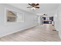 Bright living room featuring light wood floors, and large windows at 55 E Regent St, Indianapolis, IN 46225