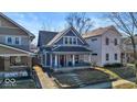 Charming two-story home with a covered front porch and inviting curb appeal at 625 Sanders St, Indianapolis, IN 46203