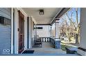 Cozy front porch with chairs and decorative columns, perfect for relaxing outdoors at 625 Sanders St, Indianapolis, IN 46203