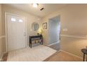 Bright entryway with wood floors and a simple console table at 10402 Sun Gold Ct, Fishers, IN 46037