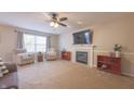 Spacious living room featuring a fireplace and large TV at 10402 Sun Gold Ct, Fishers, IN 46037