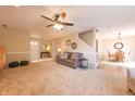 Open living room with a comfortable couch and view into dining area at 10402 Sun Gold Ct, Fishers, IN 46037