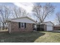 Side view of brick ranch house showcasing its brickwork at 105 Kenova Dr, Indianapolis, IN 46227