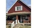 Charming two-story home with a welcoming front porch and beautifully maintained lawn at 1341 N Dearborn St, Indianapolis, IN 46201