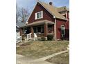 Charming two-story home with a welcoming front porch and beautifully maintained lawn at 1341 N Dearborn St, Indianapolis, IN 46201
