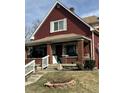 Charming two-story home with a welcoming front porch and beautifully maintained lawn at 1341 N Dearborn St, Indianapolis, IN 46201