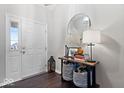 Bright entryway with a console table and mirror at 1402 W Limestone Way, Fortville, IN 46040
