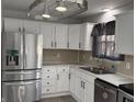 Modern kitchen with stainless steel appliances and white cabinets at 1519 Mary Dr, Lebanon, IN 46052
