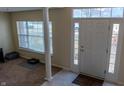 Bright entryway with columns, window, and door at 15314 Mystic Rock Dr, Carmel, IN 46033