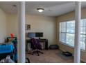 Home office with computer setup and large window at 15314 Mystic Rock Dr, Carmel, IN 46033