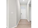 Bright foyer with hardwood floors and white door at 16930 Cole Evans Dr, Noblesville, IN 46060