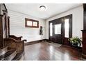 Inviting foyer with wood floors, stylish decor, and a view of the staircase at 3356 N Park Ave, Indianapolis, IN 46205