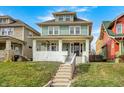 Charming two-story home with a welcoming front porch and well-maintained lawn at 3356 N Park Ave, Indianapolis, IN 46205