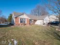Brick front ranch home with a well-manicured lawn at 6264 Whitaker Farms Dr, Indianapolis, IN 46237