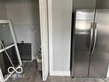 Abundant storage space featuring a stainless steel refrigerator and shelving for organization at 859 E Gray St, Martinsville, IN 46151