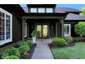 Inviting front porch with double doors, manicured landscaping, and charming curb appeal at 11710 Cold Creek Ct, Zionsville, IN 46077