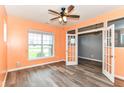Bright office space with hardwood floors, a ceiling fan, lots of natural light and a french door entrance at 1324 Trailside Dr, Greenwood, IN 46143
