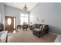 Spacious living room with vaulted ceiling and comfy seating at 1642 Foxmere Blvd, Greenwood, IN 46142