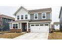 Charming two-story home with gray siding, white trim, and a well-maintained front lawn at 2242 Egbert Rd, Westfield, IN 46074
