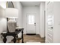 Bright foyer featuring light-colored wood floors, white walls, and an entry table with modern accents at 2242 Egbert Rd, Westfield, IN 46074