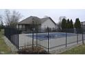 Community pool with black fence and pool cover at 240 Legends Creek Pl # 103, Indianapolis, IN 46229