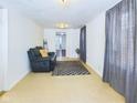 Inviting living room with plush recliner and warm interior tones at 2414 W 16Th St, Anderson, IN 46016