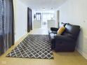 Comfortable living area with stylish rug and cozy seating arrangement at 2414 W 16Th St, Anderson, IN 46016