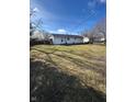 Large backyard with grass and mature trees at 2708 E 26Th St, Muncie, IN 47302