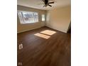 Living room with hardwood floors and large windows at 2708 E 26Th St, Muncie, IN 47302