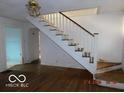 Simple wooden staircase connecting the floors of the house at 3531 Brown St, Anderson, IN 46013