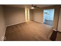 Spacious living room with neutral walls and carpet at 5209 Laredo St, Indianapolis, IN 46237