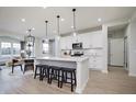 Modern kitchen with white cabinets, stainless steel appliances, and an island at 6345 Stone Side Dr, Plainfield, IN 46168