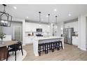 Modern kitchen with white cabinets, stainless steel appliances, and an island at 6345 Stone Side Dr, Plainfield, IN 46168
