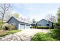Charming single Gathering home with an attached two-car garage and a well-manicured front yard at 8041 Halyard Way, Indianapolis, IN 46236