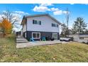 Spacious backyard with patio, grassy area, and play equipment at 8598 S Riser Dr, Nineveh, IN 46164