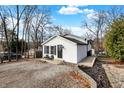 White house with gray accents, stone driveway, and landscaping at 8598 S Riser Dr, Nineveh, IN 46164