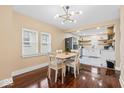 Bright dining area adjacent to the kitchen, featuring hardwood floors and natural light at 916 N Bradley Ave, Indianapolis, IN 46201