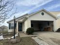 House exterior featuring a garage and landscaping at 1810 Farm Meadow Dr, Greenwood, IN 46143