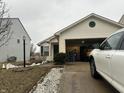House exterior showcasing a garage and front yard at 1810 Farm Meadow Dr, Greenwood, IN 46143